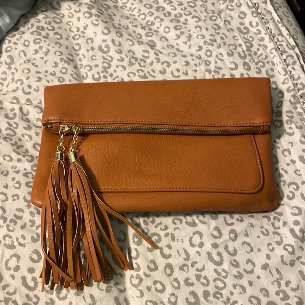 Cognac leather fold over clutch with tassels